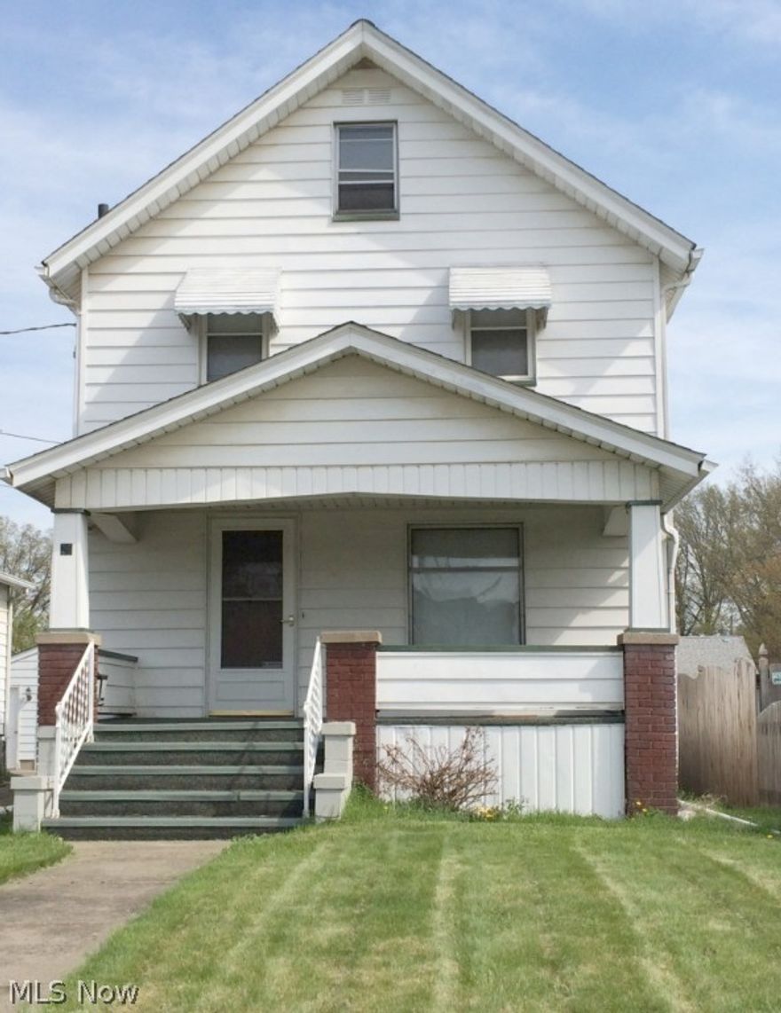 Great Deal!  Relaxing front porch!  Formal living room and formal dining room.  Natural woodwork throughout!  New kitchen and upscale new appliances.  Full of character with updates throughout!  Wood flooring!  3 Bedrooms, 1.5 baths.  Roof 2012.  100AMP breaker box 2012.  Newer furnace and carpeting upstairs.  Newer vinyl tilt-in windows and glass block windows in the basement.  2-Car garage.  Located in a scenic neighborhood with well maintained homes.  Opportunity to buy home next door as well.  Home Warranty!  Priced to sell!