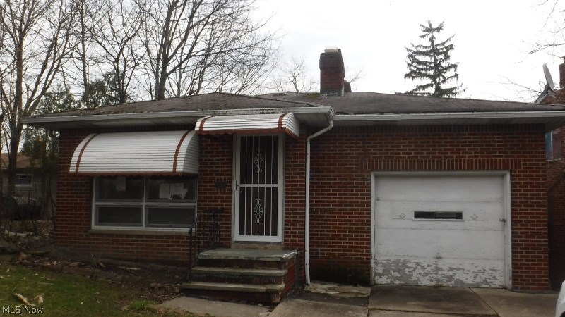 Spacious living room with fireplace. Finished lower level with sliding doors to back yard. Two full baths. Attached garage. Plus More. This home could be gorgeous with some carpet and paint and a little TLC! Property to be sold as-is.