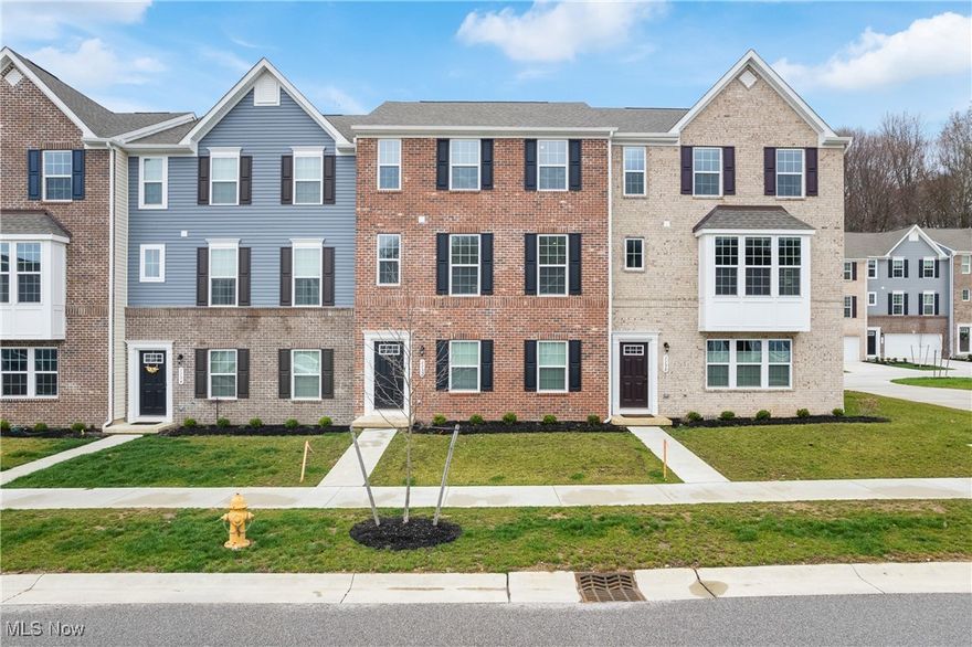 Welcome home to 1132 Bean Ln in Akron/Cuyahoga Falls. This towering townhouse has three levels of finished space. The home includes roughly 1900 square feet, three bedrooms, 2.5 baths and the location is unmatchable. The first floor includes spacious two car garage, large rec room, and access to exterior. The second level features the extensive kitchen, lovely living room, dining room and a tucked away powder room. The kitchen includes an enormous island, granite countertops, abundant cabinetry and all new stainless steel appliances. This space is open and perfect for entertaining. The third level includes master-suite featuring a walk- in closet, generous sized master bathroom with his & her sinks. There are additional two bedrooms, second full bath and third floor laundry (washer & dryer included). The community is pleasant featuring many sidewalks making it very walkable. The located is in the heart of the Cuyahoga Valley, minutes from Cuyahoga National Parks, Cuyahoga Falls downtown/Front Street, Fairlawn, Summit Mall, highway access and many other restaurants & amenities'. The best part is this townhouse is basically brand new and still in immaculate condition. This is a delightful place to call home! Call/text from your private showing today!