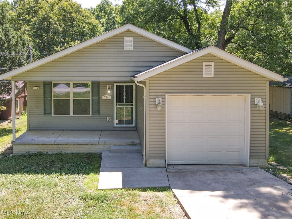 This charming ranch home in Tallmadge City Schools offers a cozy covered front porch, spacious living room, large kitchen and dining area, mudroom with laundry, three bedrooms including a main bedroom with full bathroom and closet, and an attached garage. The unfinished basement provides ample storage space or the opportunity for future customization. With a nearly half-acre lot and updated furnace and A/C, this home is ready for its new owners to make it their own. Don't miss out on the chance to see all that this property has to offer - schedule your showing today!