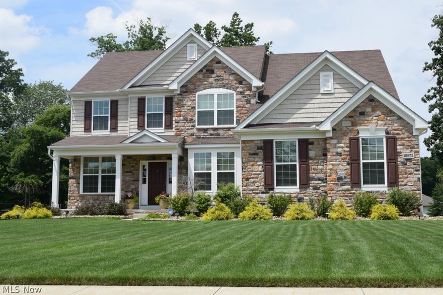 Seller will pay $1,000 towards buyers closing costs. A wonderful home built in 2011 with hardwoods in foyer and kitchen.  Family room has double stacked windows with shutters, 18ft ceilings, and a gas fireplace. The kitchen has stainless, tile backsplash , glass cook top, recessed lighting and granite. Large owner's suite has a fabulous bath with double sinks, tiled floor, and WIC. Home is move-in-ready with neutral colors and is immaculate. Four bedrooms upstairs along with loft and bonus room. Wonderful patio area, with a manicured  yard that has an irrigation system in the entire yard! 
Upgrades are the mud sink, security system, matching stone mailbox, tile in kitchen and owner's bath, patio with stone steps, shutters, sprinkler systems, mitigation system, shelves in the garage, and painted garage.  
You will find additional space in the roomy unfinished 13-course basement.