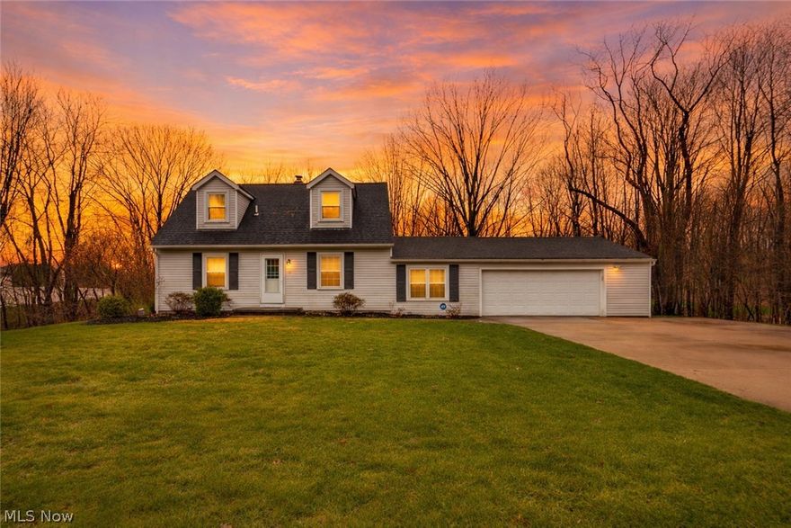 Come check out this rare opportunity to own a meticulously maintained Cape Cod sitting on nearly 2 acres. This 3-bedroom home is packed with recent upgrades, including fresh paint and new carpet throughout (2025). The heart of the home is the updated galley kitchen (2013), featuring gorgeous Corian countertops, a full suite of stainless steel appliances, and tons of cabinet space. Entertaining is effortless in a breezeway/dining area with bamboo flooring that provides access to the deck. Completing the main floor are two comfy bedrooms with fresh paint and carpet, and a full bath with a newer vanity. Venturing upstairs, you'll find a bonus room/storage area that leads to the primary bedroom, which features a half bath. In the basement, you'll find a nicely sized rec room area boasting new paint and carpet perfect for a playroom, home office, or entertainment space. Outside, discover a paved driveway that leads to a two-car attached garage with room for additional parking. The backyard features a Trex deck overlooking a sprawling backyard that stretches all the way to a quiet cul-de-sac and features a creek. Updated mechanicals include a brand-new septic system (March 2026) and a newer AC (2024). Plus, the home is minutes away from Kimpton Middle School and Riverview Elementary, and close to amenities as well. Don't miss your chance to see this beautiful home; schedule your showing today!