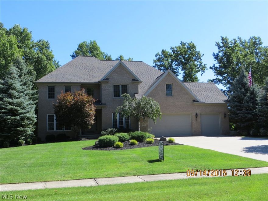 Dramatic Colonial with 2 Story Great Room and Foyer!  Maple Hardwood Flooring; Marble Flooring in Kitchen;  Gourmet Kitchen with Large Island and Granite tops!  Travertine Ceramic Tile in Baths!  Large Master with Vaulted Glamour Bath, Tile Shower, Quartz Countertops, Vessel Sinks and Jetted Tub!  Spectacular Rear Private Patio and Gardens!  Lower Level Office and Workout Room!  5th Bedroom or Bonus Room;  Jack-n-Jill Bath;  Many Customized Trim Details!  3 Car Garage!  Professionally Landscaped!