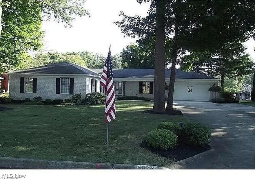 Charming well maintained, beautifully landscaped 3-bedrom, 3-bath executive ranch in Alliance, OH.  Home boasts one floor living, a spacious layout with a welcoming living area and cozy fireplace.  Oversized dining room or additional living area. The kitchen has ample cabinet space and a breakfast nook.  Laundry is also conveniently located on the first floor.  Master bedroom has ensuite and walk-in closet.  Home has a full basement (1925 sq ft) with unique walkout convenient for handyman access to lower-level living and the workshop area. Finished carpeted rec room with wet bar. Additional finished room, bathroom and separate shower.  Overlooking spacious fenced in backyard is a large 3-season room great for entertaining.
Two-car attached garage.  A must see!