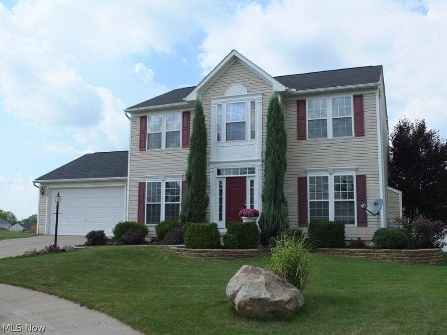 Move-in ready! Absolutely gorgeous 4 bedroom, 3.5 bath home with finished lower level and updated kitchen! Inviting foyer has beautiful hardwood flooring and crown molding. The great room is open to the kitchen and dinette and offers a stone fireplace with a beautiful mantle. The updated kitchen has refinished hardwood floors, an island with breakfast bar, new granite countertops, new glass tile backsplash, new sink and new faucet. Kitchen comes applianced with stainless steel dishwasher, range, oven, refrigerator and over the range microwave. Formal living room has crown molding and high ceilings. Formal dining room has a new chandelier, crown molding and chair rail. Half bath with pedestal sink on the main level - very convenient! The master suite has a huge walk-in closet, cathedral ceiling and a private, updated master bath with a double sink vanity, new lights, new mirror frame, new tub faucet, new tile floor and tile around the jetted tub and marble surround. There are 3 addition