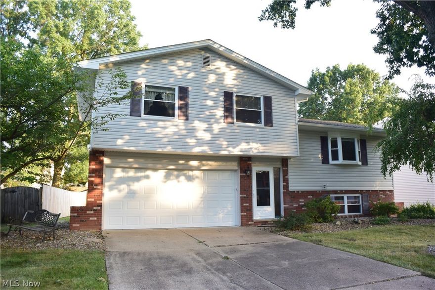 Just move in and enjoy this absolutely immaculate split level that has been taken care of with love. The owner has just installed a new air conditioner, the kitchen remodeled in 2020, the house and garage shingles replaced in 2012, the furnace approximately 2013, the siding, gutters, soffits, and downspouts in 2012, the hot water tank in 2016, the ceiling fans 2020, ventless fireplace with remote in the family room, sump pump 2020. You will love the laundry room: cabinetry, sink, washer, dryer, freezer, and sink. Window replaced. The backyard is fenced in (the owner does NOT own the fencing) and shed.

The living room opens up to the dining room and kitchen. There is a half bath off the foyer. Attached 2-car garage. Deck off the dining room.