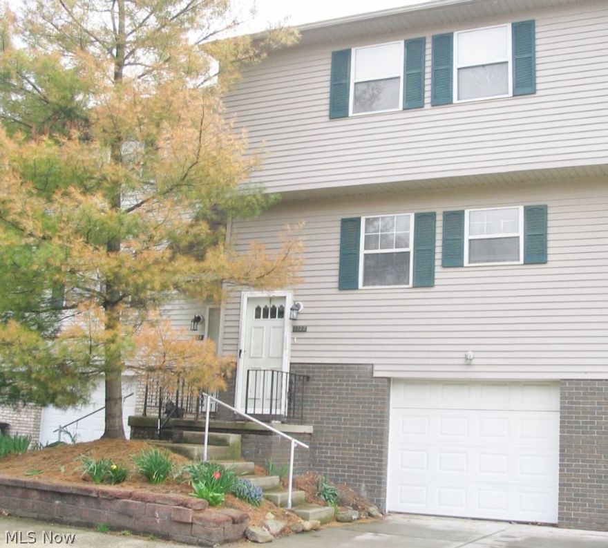 Townhouse Condo features Open Living Room & Dining Room Area with Wood Burning Fireplace.  Patio Doors to the backyard area.  Kitchen features eat-in area and all Appliances.  Three Bedrooms with Full Bath on the Second Floor.  Partial Basement with Laundry Area and 1 Car Attached Garage.  Freshly painted with Neutral Colors.  Close to major Highways, Shopping & Dining.  Nothing to do but MOVE-IN!