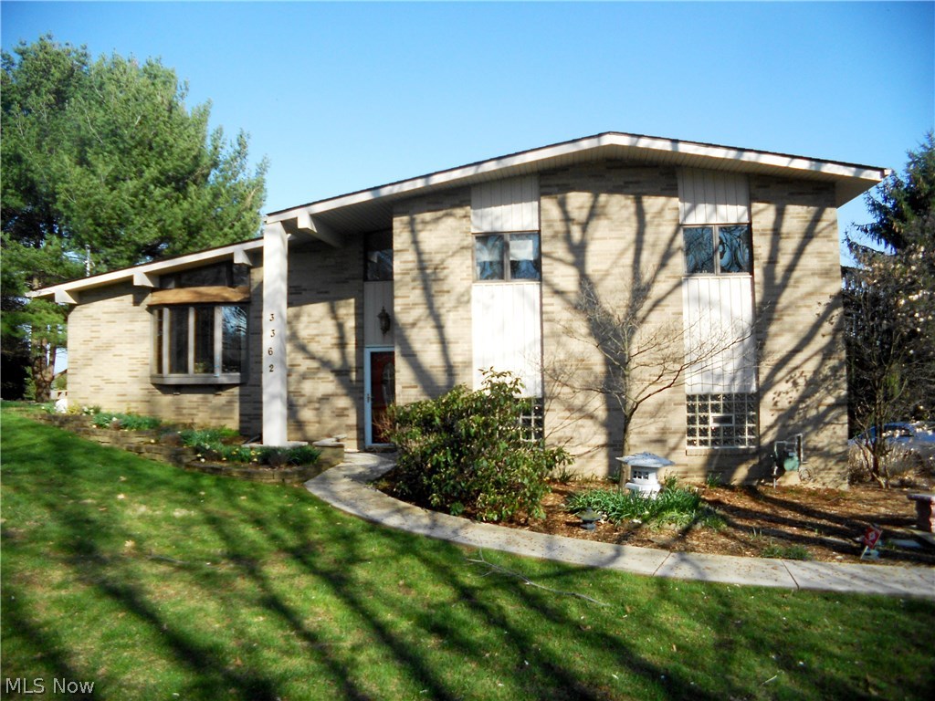 Stunning 3 level split with amazing views. This 3 bedroom, 2 bath home features a great room with cathedral ceilings and a bay window. The formal dining room has sliders that lead to the sun room with ceiling fan where you can entertain or just relax and enjoy the beautiful scenery. With 6 sliders to the wrap around deck you'll have easy access from the sun room to the outdoors. The large applianced kitchen offers a pull out pantry, plenty of cabinets and counter space, plus a breakfast bar overlooking this awesome property. The master bedroom offers sliders to a private deck for that first cup of morning coffee. The second floor full bath has been updated with Corian counters, a double sink maple vanity, heated floor, walk-in shower and soaking tub. All the bedrooms are a good size and have nice closet space. On the lower level you'll find a large rec room accented by a fireplace, another full bath and a walk-in closet with washer/dryer hookup. The rear entry heated garage off