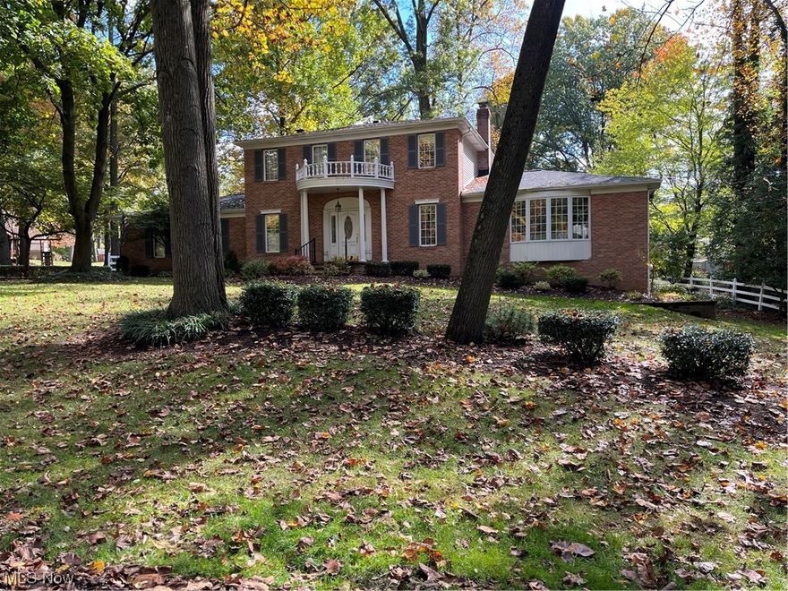 Original owners offering up their quality built stately colonial home with pillared front porch and balcony above.  Leaded glass entryway with sidelights and hardwood foyer.   French doors open to the living room with bayed window and decorative fireplace.  The formal dining room has hardwood floors and chair railings.  Eat-in kitchen comes with all stainless appliances, granite countertops, plenty of cupboards and storage areas and tiled flooring.  The family room offers a large bank of windows, fireplace and built in bookcases.  The 3 seasons room welcomes you with it's vaulted ceiling, ceiling fan and great view of the backyard.  From the 3 seasons room you can either access the deck with engineered wood or the stamped concrete patio.  The 1st floor laundry/mud room (washer & dryer stay) and 1/2 bath complete the main living area.  Upstairs you'll find the primary bedroom with en-suite bath and 3 additional bedrooms - all with ceiling fans and the other full bath with double bowl sinks.  The basement is ready for you to finish off and offers a brick wall ready for another fireplace and wood burner and also offers a walk-out to the backyard.  The backyard is fenced, has an area for a herb garden with water fountain and a trellis with swing.  The 2 car attached garage has built in cupboards, man door to the backyard, utility sink and pull down attic storage.  A great place to call home!