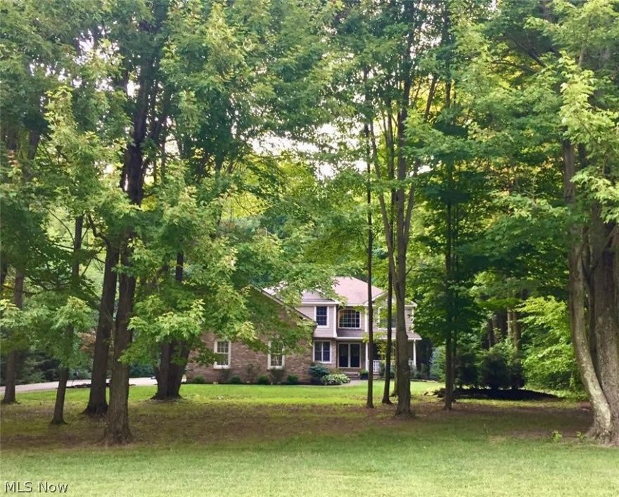 Quality Built 4,229 sq.ft Colonial, tucked away on a private, wooded 2 acre property w/ 6 bedrooms, 5 full baths, finished basement, an oversized 3 car side load garage & public water! The attractive exterior showcases lush landscaping, stamped concrete walkways & charming covered front porch. The elegant 2 story entry boasts gleaming hardwood floors that flow into the formal dining room w/ tray ceiling. French doors open to the private office. Impressive 2 story family room w/ beautiful brick fireplace flanked by windows with views of the wooded backyard. The custom country style eat-in kitchen is complete w/ a sprawling center island w/ seating, granite countertops, backsplash, plenty of cabinetry, dining area & included appliances. A convenient first floor bedroom, full bath & laundry room complete the main level. The gracious open stairway takes you upstairs to the master suite featuring a cozy fireplace, glamour bath w/ double sinks, soaking tub, shower & huge walk in closet & bon