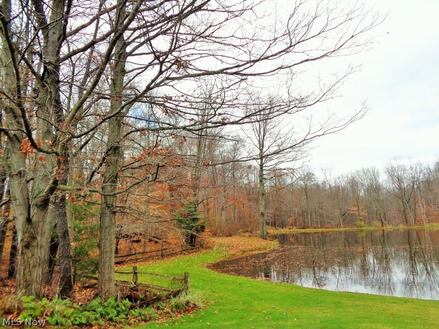 Beautiful wooded and water front 3.5 acre lot in the desirable South Range School District, Beaver Township. Great place to build your dream home over looking the 1 acre lake. Call before it's gone!  Gas available at street. Owner will transfer mineral rights.