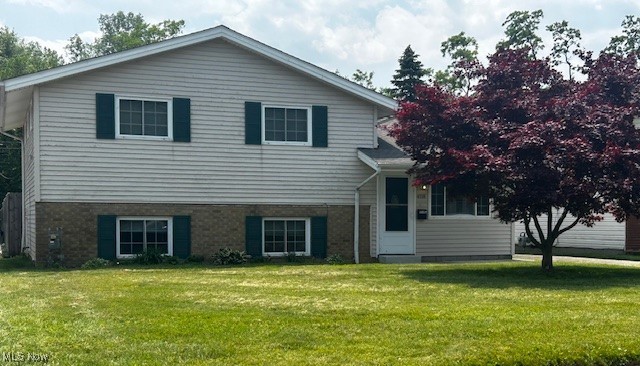 This beautiful split-level offers an open floor plan, vaulted ceilings, stylish laminate floors and ample sunlight. The family room flows seamlessly into a spacious eat-in kitchen featuring granite countertops, white soft-close cabinets, and all the sleek stainless steel appliances remain with the home perfect for every day living and entertaining. This home offers 3 bedrooms and two full baths. The versatile lower level is currently being used as a master suite, complete with walk in closet, an en-suite bathroom and a laundry room. A third floor offers a bonus room that provides flexible space that can be used as a playroom, home office, additional storage or whatever you need. Major renovations and updates include: a complete roof tear off in 2024, new AC unit in 2023, and a new furnace in 2022. Extra storage and space found in the detached 2 car garage. Enjoy the privacy of a large, fully fenced in backyard, ideal for outdoor gatherings or relaxing evenings. The backyard shed remains with the home. Enjoy time outside on the patio. The community of Sheffield Lake also offers a nearby playground, Lakeview Beach, grocery store, boat launch, and a dog park. This home checks all of the boxes, don't miss an opportunity to make this home yours!