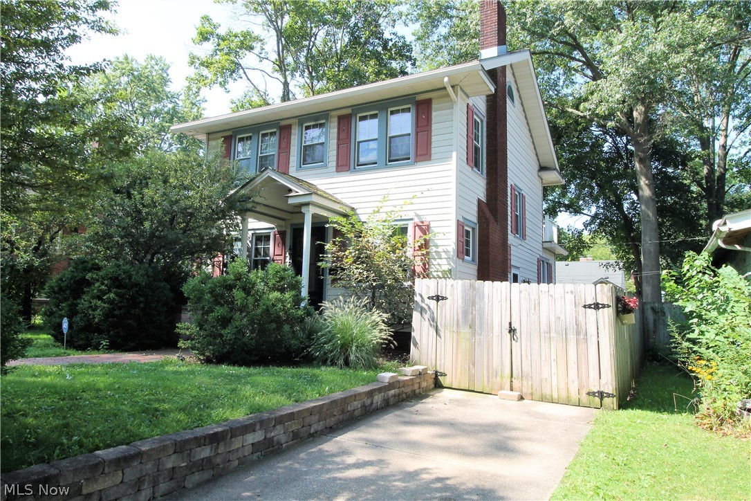 Own with pride with this fabulous three bedroom colonial home with newer roof. Come on up the gorgeous hardscape front, with mature landscaping, through the newer front door and into the large living room offering fireplace with mantle, dining room, hardwood floors throughout, vinyl windows, plethora of windows to let the natural light shine through. The large, bright updated open kitchen is a chef's delight with all the counter space, abundance of cabinets and stainless steel appliances. There is a first floor laundry area. Upstairs you will find three bedrooms and a full bathroom. There is a veranda with a gate off of one of the bedrooms to sit out and enjoy. The lower level is very clean, has a half bath, plenty of room for work out area, storage etc. There is a two car attached garage with a new garage door opener. The beautiful backyard is fully fenced in with a gate and has so much room for entertaining, or just relaxing. WOW! Precious memories begin right here!