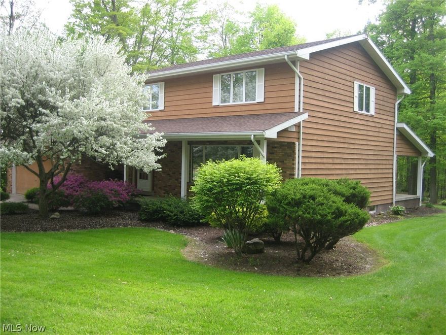 5.17 Acre wooded setting compliments this 2 story, 1 Owner Colonial that was  built to last.  Features Cedar and brick exterior with Sandstone accents. Enter this quality home into roomy Foyer with large guest closet. 1st floor Family room boasts full wall Brick Fireplace with Sandstone Hearth. Eat-in kitchen offers plenty of cupboards and counters, pantry, laundry closet and access to amazing 12 X 36 covered rear porch overlooking acres of landscaping, woods and beautiful tranquility.  The formal dining room is perfect for entertaining.  Spacious living room and 1/2 bath complete the 1st floor living area. Oversized stairway leads you to the second level offering Master suite, 2 additional generous bedrooms and full bath. Full heated basement w/two entrances ( from the kitchen and garage) allows a clean slate for your finishing designs. Features full kitchen ready for your canning or Holiday cooking, full bath, utility room that houses Multi-fuel HS-Tarm boiler, new water heater, Serv