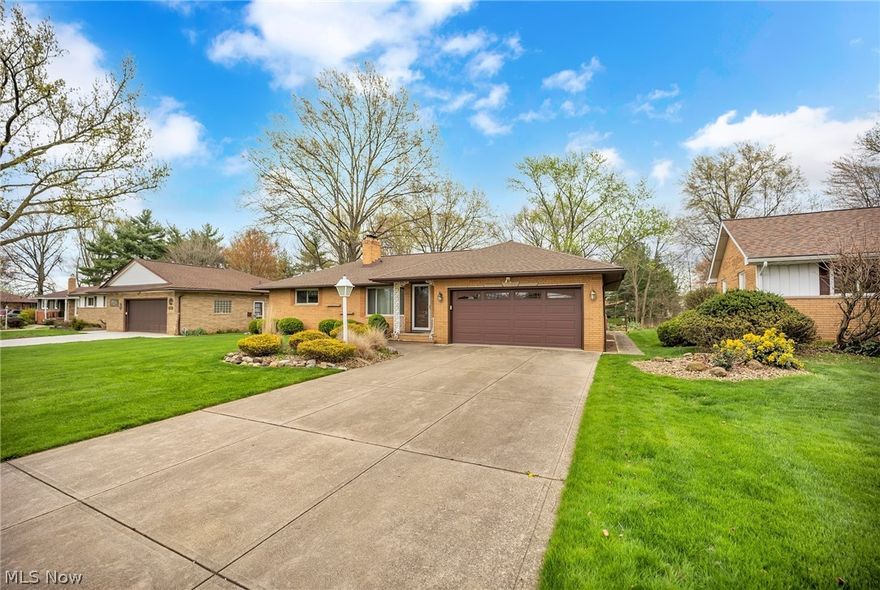 Welcome to this charming ranch-style home. Step inside and be greeted by the carpeted living room that boasts a stone accent wall and a wood-burning fireplace. The living room flows effortlessly into the dining room and family room with large windows that allow plenty of natural light to fill every corner. The eat-in kitchen has a white tile backsplash to match the all-white appliances along with an area that would fit a breakfast table perfectly for additional seating. Off of the kitchen is the laundry room with wash tub and half bath. All 3 bedrooms are spacious and have sizable closets that will meet all of your storage needs. The shared full bathroom has a single-sink vanity and a walk-in shower. Downstairs in the partially finished basement is where you can find the bar area, rec room and second full bath. It also has  a large storage and workshop area. Outback is the wide open backyard with a large storage shed and is ideal for pets and children to play while the adults spend a relaxing evening on the concrete patio. The patio has a bridge through the garden that leads to the back yard. This home has an endless amount of potential and is just waiting for its new owners to come in and make it their own.