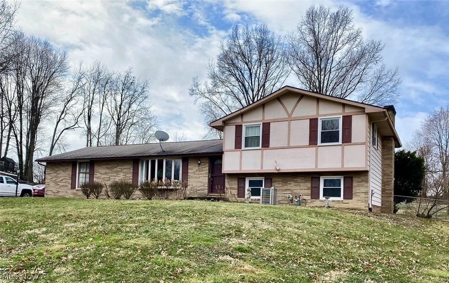 Home features a kitchen with appliances, a dining room with a sliding door to the backyard, and a living room on the main level. Upstairs with 3 bedrooms with closets and full bath. Lower level with large family room with brick fireplace and sliding door to patio, full bath and utility room with laundry hookups. Double car garage with openers, nice back yard with garden shed. The home has been loved by the same owner for over 60 years and is ready for updating! Updates to the home include a furnace and hot water tank ( 2012 ) sump pump ( 2015 ) windows ( 2014 ) gutters/leaf guard ( 2015).