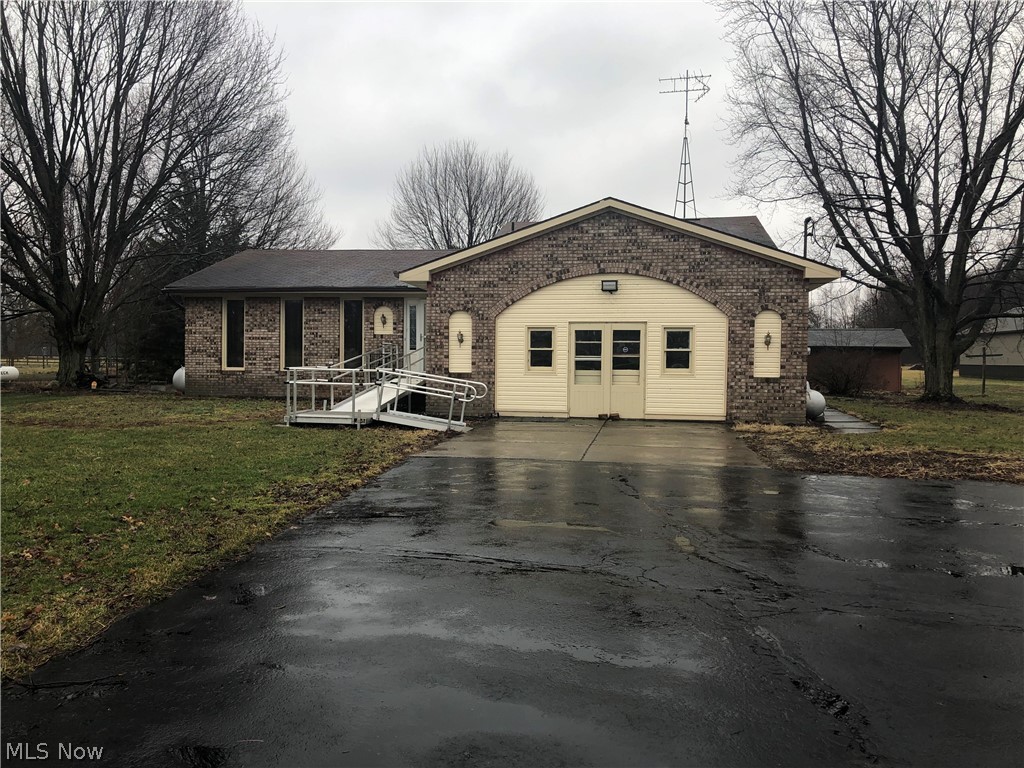 Searching for value, size and location? Check out this spacious multi-level home on 3 acres that needs your TLC skills! Offering a formal living room with hardwood flooring, spacious kitchen and dining area all on the main floor. Upstairs you will find 3 very spacious bedrooms, a full bath that includes a roll in shower! The lower level boasts a huge family room with tile flooring and fireplace, an office area, full bath and laundry room! There is also a spacious basement that can be adapted for any use! The 2 car attached garage is in need of an overhead door as the garage was converted to a work area at one time. Off the back of the home is an enclosed sunroom, patio and more!