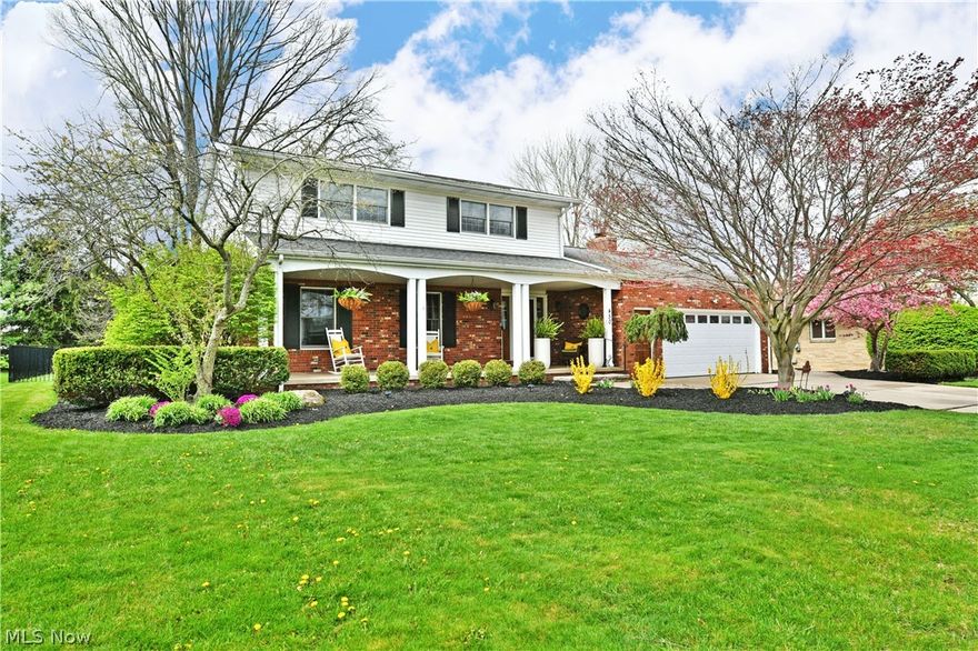 A symphony of style, elegance, and class, this remarkable Warren home raises the bar with three floors of beautifully finished living space and a must-see backyard ready for summer enjoyment. Nestled along a quiet side street near the Country Club development, this impressive brick residence delivers a thoughtfully designed three-bedroom layout that is sure to impress. Manicured mulch beds and vibrant spring blooms create a warm welcome as a brick walkway leads to the covered front porch, perfect for relaxing in the shade. Out back, winding sidewalks guide you through the fenced-in yard to a sprawling patio surrounded by lush landscaping and a tree-lined backdrop for added privacy. Inside, a wood-trimmed staircase rises from the inviting foyer, where rich hardwood flooring flows throughout. Elegant wall coverings showcase an ornate pattern, adding a touch of sophistication. The living room offers a cozy retreat with soft lighting, seamlessly connecting to the formal dining room, where a sparkling crystal chandelier highlights the space alongside a stylish coffee bar. The central kitchen is both functional and refined, featuring wraparound cabinetry, a stone tile backsplash, and a hooded range. Casual dining enjoys a bright bay window with scenic backyard views. A rear entry, ample closet storage, and a sleek half bath add everyday convenience, while the family room showcases rich tones, a striking brick fireplace, and custom built-ins. Upstairs, a well-appointed full bath sits off the landing as the hallway leads to three spacious bedrooms, including an oversized master suite complete with a private bath and tiled shower. The finished lower level expands your living space with a second family or recreation room, along with dedicated laundry, gym space, and additional hidden storage. Updates: roof 2012, kitchen bay window 2021, furnace 2021, waterproofed basement 2022, garage door 2018, wrought iron fence 2018, and so much more! Plus a one-year home warranty!