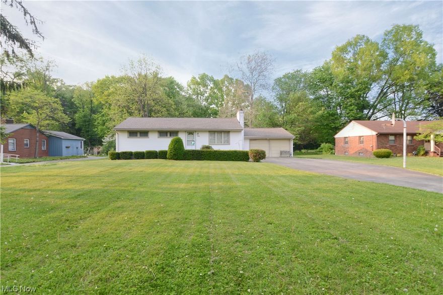 Wow if you are looking for an amazing ranch home sitting on a great 1.41 acre lot in Canfield Township look no further! Sure you may want to update some of the mechanicals and cosmetics here but the potential is awesome! Pulling into the drive you will be greeted by a well maintained vinyl sided exterior. The front entry leads to the spacious carpeted living room with and also a coat closet with attic access! Beautiful fireplace. This room opens up to a large dinette and kitchen with great cabinet and countertop space, plus the appliances stay for the new owner. Three spacious bedrooms, all hardwood with great lighted closets! The full bath has ceramic flooring and shower tub surround that was replaced at one time. There is a full basement accessed from the attached two car garage. The basement is partially finished with a bedroom, a great rec room with bar area, laundry room with washer and dryer and utility area. Central Air. Vinyl Windows. This home has been professionally pre-inspe