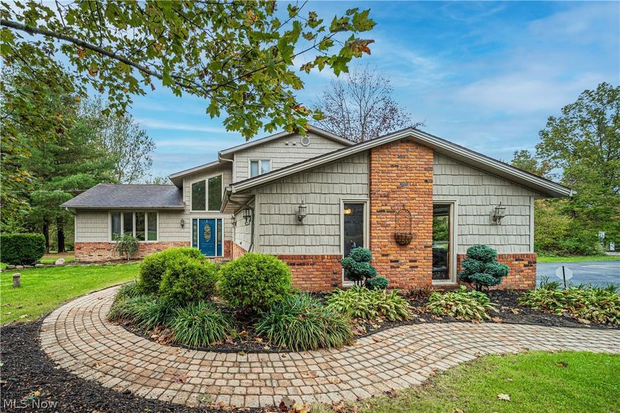 Welcome Home!  This one is all ready for you to just move right in!  Highlights of this home feature: Updated kitchen with beautiful cabinetry, quartz countertops and an eat in area * The front room is currently set up for a formal dining room that adjoins a living room area * a couple steps down takes you to a warm family room space with fireplace and built in beverage serving space * the back of the home boosts a large sun room with walls of windows and will be the hang out for all your gatherings! * first floor also offers a bedroom or office space * Owners bedroom with full bath and two additional bedrooms and hall full bath are located up a few steps to the second level.  The lower level has a rec room space and also plenty of storage area.  The home is situated on a roomy 1+ acre lot with circle driveway and has a fantastic paver stone patio in the backyard for entertaining and relaxing.  Septic was replaced in 2015.