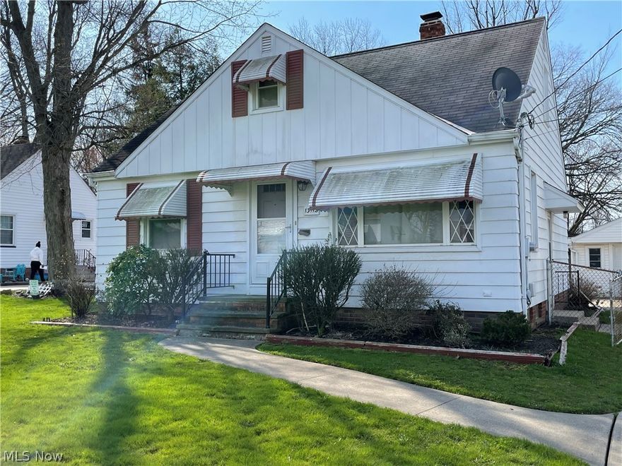 You will love this move in ready Garfield Hts home! Featuring 3 bedrooms and 3 full baths. Fantastic master suite on second floor with beautifully tiled bathroom and modern fixtures, sitting area and large closet for storage. Main floor has 3 nice size bedrooms, large living room and updated bathroom. The eat in kitchen has a sliding glass door out to the covered deck overlooking the large backyard. Finished basement with tile flooring and another full bathroom. This home has updated windows, flooring, furnace, central air, water tank and glass block windows in basement. One car garage with extra covered carport attached or use as a covered patio. Great location! Walking distance to Marymount Hospital.