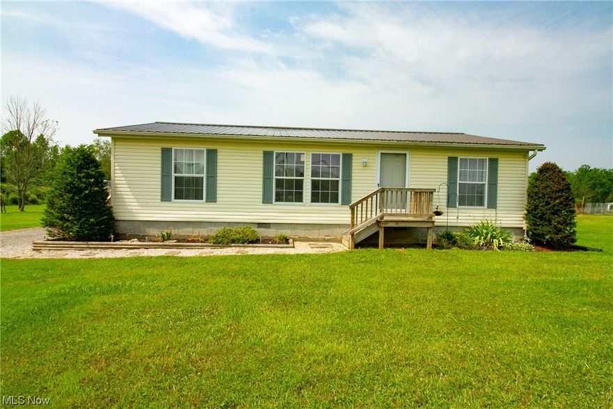 Welcome to this charming move in ready ranch home situated on a spacious 1.48-acre lot. Boasting three bedrooms and two full baths, this home offers ample space for comfortable living. Step inside and be greeted by the beautifully updated floors that enhance the overall aesthetic appeal.  The open floor plan in the living area is draping in natural light from the sky light above the eat in kitchen, creating a warm and inviting atmosphere. The primary bedroom has a walk in closet and its own full en suite. There is a clean and dry four foot high crawl space complete with a cemented floor underneath the entire length of the home for all of your extra storage needs.  This could be the home you have been waiting for! Don't wait because it will not last long!