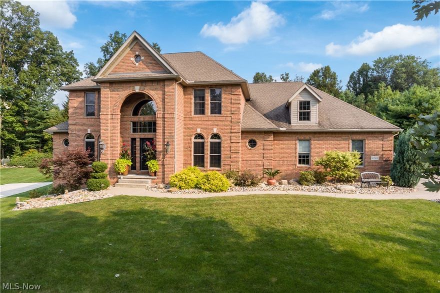 Welcome to this fabulous home in the Meadows at Nobles Pond in Jackson Twp.! Walk in to the impressive 2-story foyer that leads way to an open and spacious formal dining and then onto the 2-story great room, centered around the gas fireplace. Leading from the great room, the large gourmet kitchen offers all stainless steel appliances, double ovens, and Viking Professional Stove with granite countertops. As you make your way around the first level, you will find gorgeous refinished maple hardwood floors throughout. A master suite with large bath and two walk-in closets, office, and half bath complete this large first floor. On the second story, you will find 3 spacious bedrooms (one being a junior suite), 2 full baths, and plenty of closet space! Heading down to the partially above grade lower level with full windows giving natural light, you will find a large theatre/media area with comfortable reclining tiered seating, a projector, and large viewing area! Additionally, there is a larg