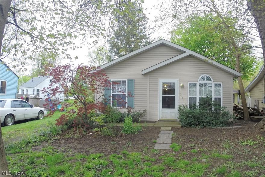 Great 3 bedroom, 1.5 bath ranch with views of Lake Erie!  Sit in your front yard and watch the Lake for peace and quiet!  This hidden gem is close to restaurants and Lake front park!  This home features cathedral ceilings in Living room and dining area and kitchen!  Lots of windows with view of Lake!  Laundry room off kitchen that has ample storage, Kitchen features oak cabinets and plenty of room!  3 spacious bedrooms, Master with walk in closet and half bath.  Freshly painted interior with light neutral colors.  There is much potential for this quaint ranch home - ready for your personal touch to make it your own!  There is also a home warranty!