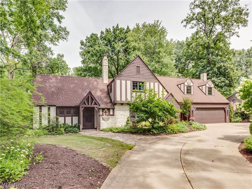 Prepared to be amazed by this spectacular Tudor style home in Silver Lake Estates with a desirable location on a 1/2 acre lot situated between Silver Lake and Crystal Lake. Truly a one of a kind masterpiece where quality & charm abounds. The foyer entrance leads to the living room/kitchen addition with wood beamed ceiling, ash wood floors, hickory cabinets, granite counters and updated appliances. There's a separate entrance to the dramatic and impressive  open and spacious great room which  has a  soaring cathedral beamed ceiling , beautiful wood floors and a gas/wood fireplace. Formal dinning room with hickory floors, cozy office or den, impressive craft room plus 1/2 bath completes the first floor. Just  a few steps leads up the private master suite with vaulted ceilings, his and her closets and beautifully updated master bathroom. The second floor has two guest bedrooms a full bath plus a second family room with a gas fireplace. The lower level has a fourth bedroom or office plus a