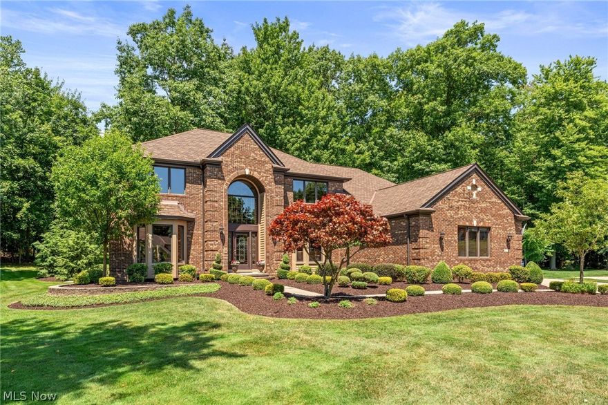 Welcome to this beautifully appointed and well maintained brick front home, with a 3-car side entry garage, and is situated on OVER .56 acre wooded cul-de-sac property, in the Broadview Glen development. This home features an impressive two-story entryway with a curved staircase, 4 bedrooms, 3 full and 1 half bath, over 4,686 living sq ft that includes a professionally finished basement with a wet bar, a beer keg dispenser, two beverage fridges, and a separate media room with media equipment, along with couches included. A gourmet eat-in kitchen features granite countertops, wine fridge, under counter lighting, and stainless steel appliances. There is a dedicated 1st floor office with French doors, formal dining room with tray ceiling, family room with a gas fireplace, and living room with bay windows. The owners' suite has a large walk-in closet and an en-suite bath with a double vanity, a large soaking tub, and a separate Roman shower. A spacious paver patio with wooded and private views completes the tour.  The following UPDATES were completed: replaced all outdoor landscaping, completed kitchen remodel, finished basement which includes a bar, game room, media room, fitness area and storage room. INCLUDED are all kitchen appliances, Ring Doorbell, security system and washer/dryer. This home is conveniently located near I-80, I-77, around the corner from playground, tennis, recreation center, easy freeway access to downtown Cleveland & Akron, airport, fine dining, metro park and many other local attractions. This home is a must see!