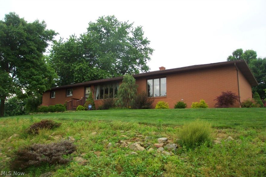 Immaculate full brick ranch with an extra buildable lot. Stunning Dutch Valley kitchen by Dale Mullet, Canadian honey birch with all the extras and Corian counters, first floor family room with cathedral ceiling, two full baths, finished lower level, replacement windows. There is a total of 1620 first floor square feet under roof, approximately 1320 of which are currently living area. The remaining 300 square feet could be a master bedroom, master bath and laundry room if one desires. This is an exceptionally nice home. Furnace and AC three years old, new garage door, well insulated, gas bills around $40 in summer, Jan '14 $126, Feb $202, March $132, Electric around $150 for present occupant. Pipe organ consumes a lot of electricity.