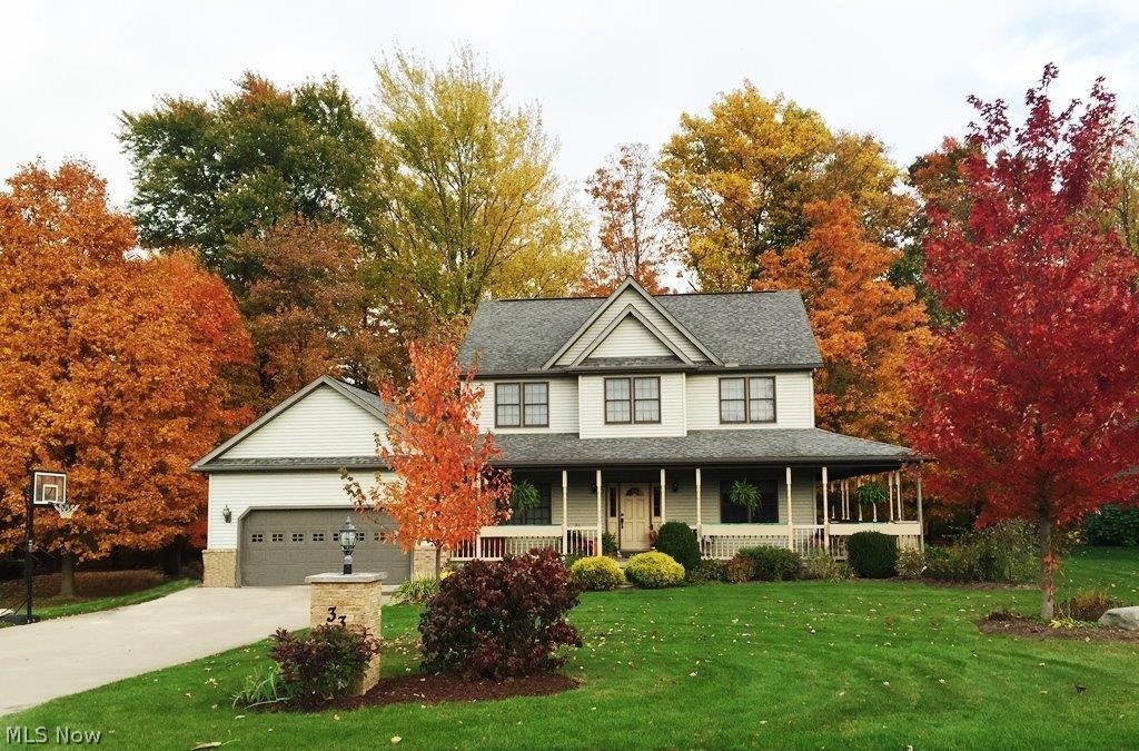 *MOVE IN READY! *4 BEDROOMS *3 1/2 BATHS *NEARLY 2300 SQ FT PLUS OVER 800 SQ FT OF NICELY FINISHED LOWER LEVEL LIVING TOO! *WOODED SETTING *WRAP AROUND COVERED PORCH *3 PLUS CAR GARAGE *1ST FLOOR LAUNDRY *GAS FIREPLACE *CITY WATER *ALL APPLIANCES STAY *ALL BEDROOMS HAVE WALK-IN CLOSETS *TONS OF STORAGE *9 FT CEILINGS FIRST FLOOR *HARDWOOD & LAMINATE FLOORING * LOWER LEVEL BAR NEGOTIABLE * SEPTIC MAINTAINED BY WAKEMAN