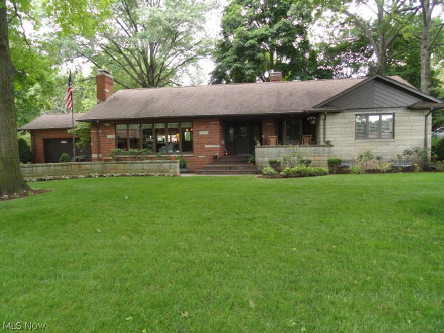 Welcome Home to this Spectacular Brick Ranch on Silver Lake Blvd.  Extensively renovated with custom features and quality construction throughout.  Floor plan redesigned to open and enlarge the main living area with rich Acacia hardwood floors which compliment the new kitchen, the formal dining and the living room with stone fireplace, built in cabinets and a wall of windows offering a seasonal lake view! Fabulous kitchen with custom birch cabinets, black granite, stainless appliances, new breakfast bar with sink, wine rack and wine cooler.  4 bedrooms, 3 full baths. There is new carpet & paint throughout.  All new light fixtures, custom blinds & fans, new sinks, fixtures, toilets, showers & jetted tub.  Finished walkout lower level family room complete with gas fireplace, full kitchen with cherry cabinets and a granite counter/breakfast bar.  The hot water radiant heat has a new stainless steel tankless boiler. New 200 amp electrical panel and newer water heater too.  Well water for i