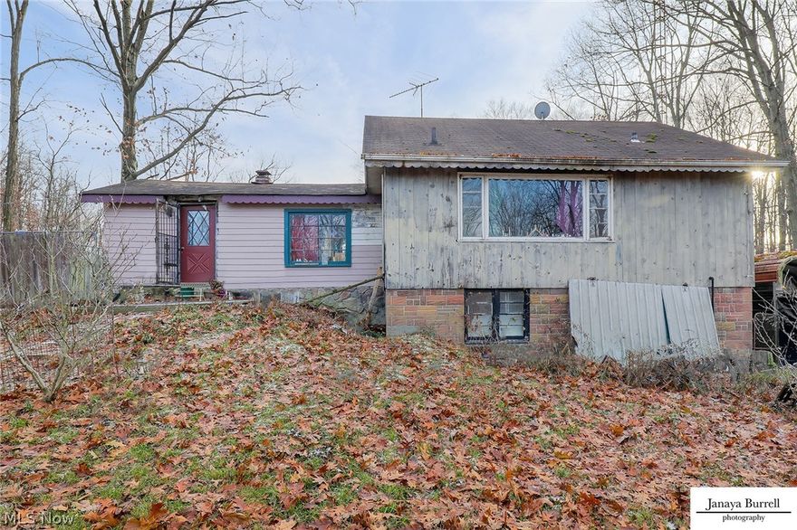 Three parcels that total 21.49 acres can be sold together or separately. Two parcels are located off Edison St. One has a single family home being sold as is. Value is in the land and outbuilding. The other parcel off Edison is ready for a home to be built where an existing single family resident used to stand facing the River/creek. Behind both parcels, 17.8 acres of unique landscapes of untouched opportunity awaits! Perfect for nature lovers, horses, ate's, hunting, you name it! So many opportunities on this secluded oasis. The views on top of the hill facing Beech Creek are stunning and can be seen from multiple scenic overlooks. The parcel with single family home has 1.84 acres and is setup for animals currently. Newer 20x30 pole building garage with 18' ceilings, electric, window, and conveniently located right off house door. Additional cemented metal carport currently being used to house docs is located on other side of home. Option to have driveway wrap around house. New septic