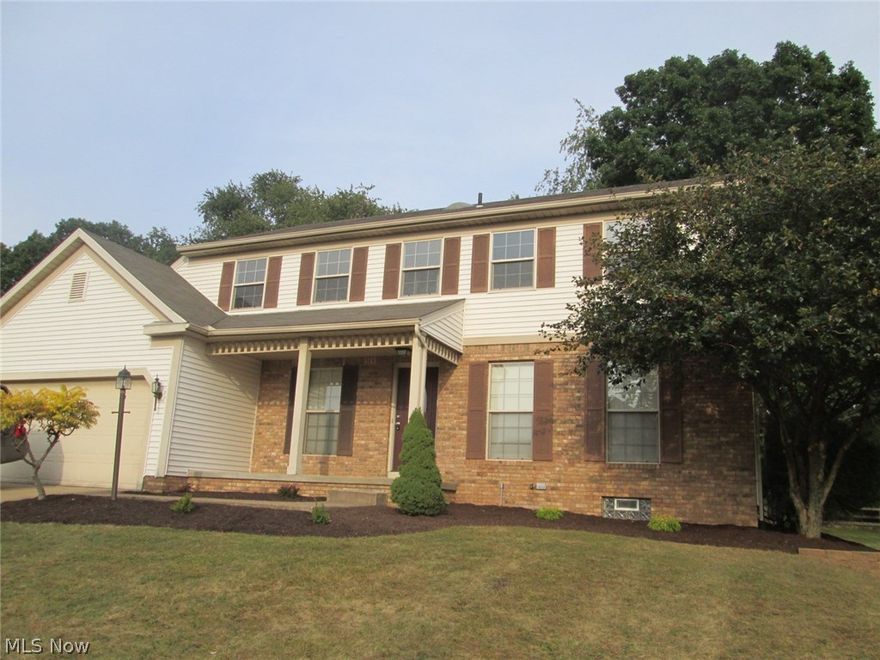 Like New and Move-In Ready with Immediate Possession!  This 4-5 bedroom, 3.5 bath updated home is nestled in a quiet neighborhood that reflects pride of ownership.  Nice curb appeal with fresh landscaping.  What a nice floor plan with a blend of open concept space and separate living areas.  Large living room opens to formal dining room.  Dining room has quality touches with columns, crown molding and wainscoting.  Huge eat-in kitchen with tons of counter space/cupboards and an island perfect for entertaining or extra seating.  Kitchen opens to nice size family room with vaulted ceiling and fireplace - cozy for the upcoming fall weather and holidays!  First floor laundry.  Convenient first floor half bath.  Second floor has a master suite with his/her closets and french doors to private bath with large soaking tub.  Separate shower area with rainfall shower head.  Three additional bedrooms and a full bath.  The lower level has a 12 x 23 bonus space with double closet, built-in shelves,