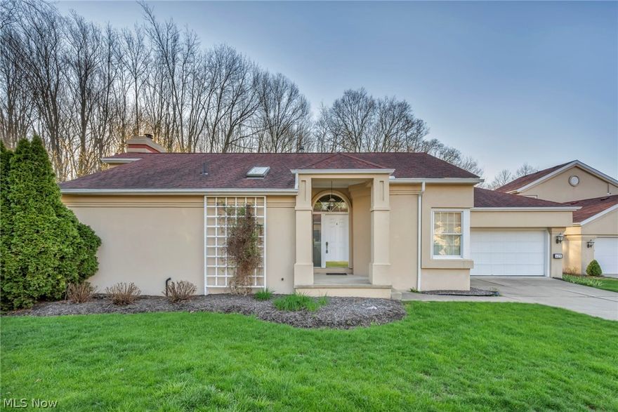 Enjoy one-level, low-maintenance living in this spacious Ranch home tucked within the Mediterranean Village community in Akron, with a back deck and lovely wooded views along a walking trail that winds through the community. Just minutes from Summit Metro Parks, Cuyahoga Valley National Park, and the Towpath Trail, and with a low monthly HOA fee that includes landscaping and snow removal, the location invites a lifestyle that blends everyday convenience with time outdoors. This move-in ready home features 2 bedrooms, 2 full baths, and 1,297 sq ft, with vaulted ceilings and an open layout that create a light-filled, airy feel throughout the main living spaces. A great room centers around a fireplace, offers direct access to the deck, and flows seamlessly into the dining area, for easy indoor-outdoor living. An eat-in kitchen provides generous counter space, stainless steel appliances, and a bright dinette area framed by windows. The primary suite offers a comfortable retreat with a walk-in closet and an en-suite bath featuring a soaking tub and separate tiled walk-in shower. A 2nd bedroom and full bath offer flexibility for guests or a home office, while a main-level laundry room adds to the ease of single-floor living. An attached 2-car garage and a full basement with ample potential complete the home, offering both practicality and room to expand. Updates include: Replaced carpet and garbage disposal. INCLUDED are ALL kitchen appliances, washer/dryer, and all window treatments. Conveniently located near OH-8, shopping, restaurants, parks, and many other local attractions. This home is a must see.