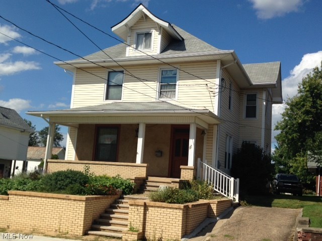 Classic three bedroom home with beautiful woodwork throughout, leaded glass entry, and many modern updates. Detached two car garage and flagstone patio.