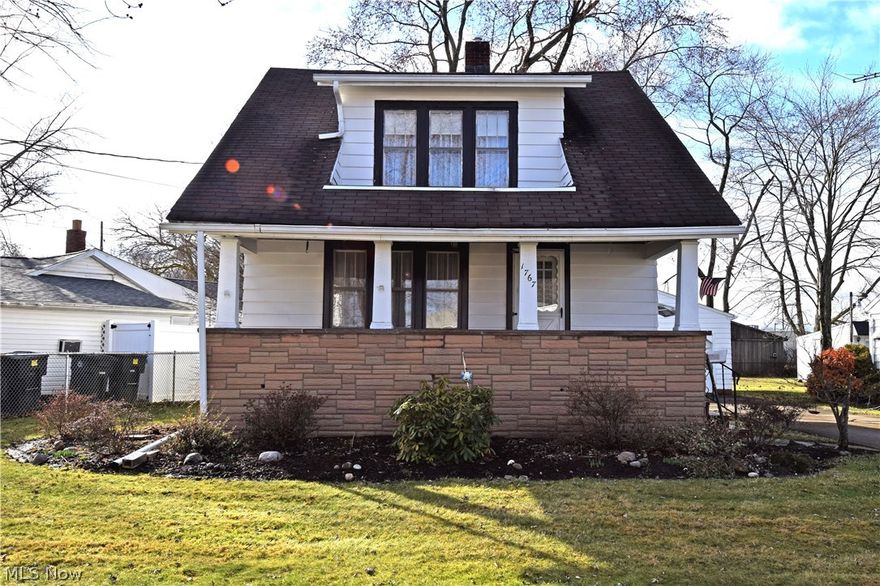 This beautiful, move-in ready home has everything you need and more! A large, stone trimmed covered porch with overlooking dormer gives a cozy, inviting appearance that continues inside. Features include an expansive, carpeted living room where you’ll make your formal entrance to the home. Wood trim graces the stucco walls that lead into a formal dining area as wood paneling rises to meet a chair rail. Nearby, a brightly colored full first floor bath offers a neatly trimmed vanity and shower. The ample kitchen space includes an additional dinning nook, along with an array of dark wooden cabinets. Upstairs, the lush carpet continues as it fills two large bedrooms. The first boasts wood panel wall treatment and features the three large dormer windows that overlook the street. The second, master bedroom showcases a unique layout with a corner closet area and dramatic sloping ceilings. Downstairs, plenty of storage area awaits along with laundry services. A concrete driveway leading to a d