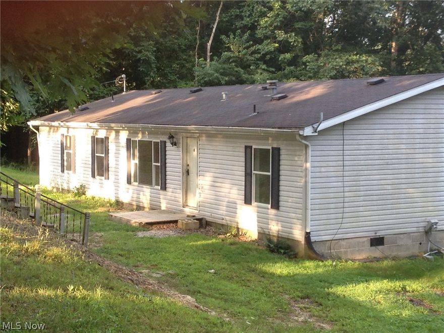 This property offers 3 bedroom , 2 full baths, open eat in kitchen , large back covered deck over looking a country view . This property is nestled upon over 3 acres of wooded land. Many updates throughout .  With accepted offer seller will install new carpet and replace front door prior to closing . East Muskingum Schools.  Rare find .  Will not last .