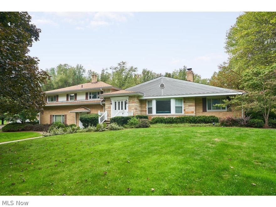 Gorgeous split level home on private beautiful 1.5 acres surrounded by mature wooded trees and pond views. The Spacious living room welcomes guests with space for entertaining and gathering by the warm fireplace with large windows providing abundant natural lighting. Open floor plan provides easy access to the Dining Room and Kitchen. The Chef's kitchen boasts warm custom wood cabinets, New Granite countertops and statinless steel appliances. The Family room provides a large casual setting for entertaining and has an a additional fireplace and wet bar. Relax in the Gorgeous Sun Room with amazing outdoor views! Beautiful Bonus Room off of the kitchen can be used as an office/den or extra bedroom. Two large size bedrooms upstairs share a newly remodeled bathroom and the Grand Master Bedroom boasts a spacious ensuite. In addition to the 2 car garage is an immaculate heated detached 3 car garage or workshop for your hobbies.