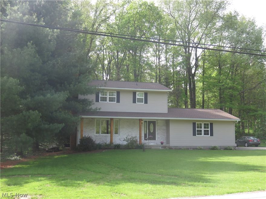 This home has been lovingly brought back to life by these sellers and you can enjoy the benefits! You will love the engineered wood flooring throughout the first floor. The large living room is accented by the wood burning fireplace, the dining room (used as office) overlooks the private backyard. The renovated kitchen has white cabs, Corian countertops. The stainless DW and fridge complete the look, so nice and bright! The Pella slider leads to the newer deck. The family room on the lower level is so spacious and so very sharp! There is a 2nd wood burning fireplace and lots of room to spread out!! You will live in this room! One sliding barn door leads to the laundry and storage areas, the other to the well room. All 3 bedrooms are up and good size. The master bdrm is large and the ensuite bath has been gutted and is very cool!! The hall bath is updated as well!! Updates include windows, glass block in bsmt, roof, siding, h2o tank, well pressure tank, water softener, lots of fresh pai