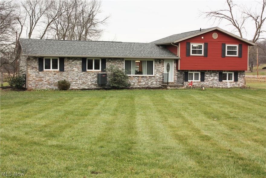 This brick and vinyl split level home is what you are looking for, providing wonderful country living on just over 4 acres! This 4 bedroom, 2 full bathroom home has been newly updated/remodeled with an all new kitchen offering granite counter tops and stainless steel appliances. The glass door from the kitchen opens to a large deck for grilling and family cookouts. New flooring was added throughout the home along with new paint. Both baths are updated and bedrooms are spacious. Furnace/heat pump, water heater, sump pumps, radon mitigation system and roof are all new in the last 3 years. A new wood burning fireplace insert offers warmth and coziness on cool nights, as you watch the embers and sip your favorite beverage. The attached 2-car garage has hot/cold water and the added convenience of access directly to the basement utility/laundry area! In addition to all this, is the detached 1,600 square feet garage/barn which has water available to access, 3 newly added stalls, and it opens