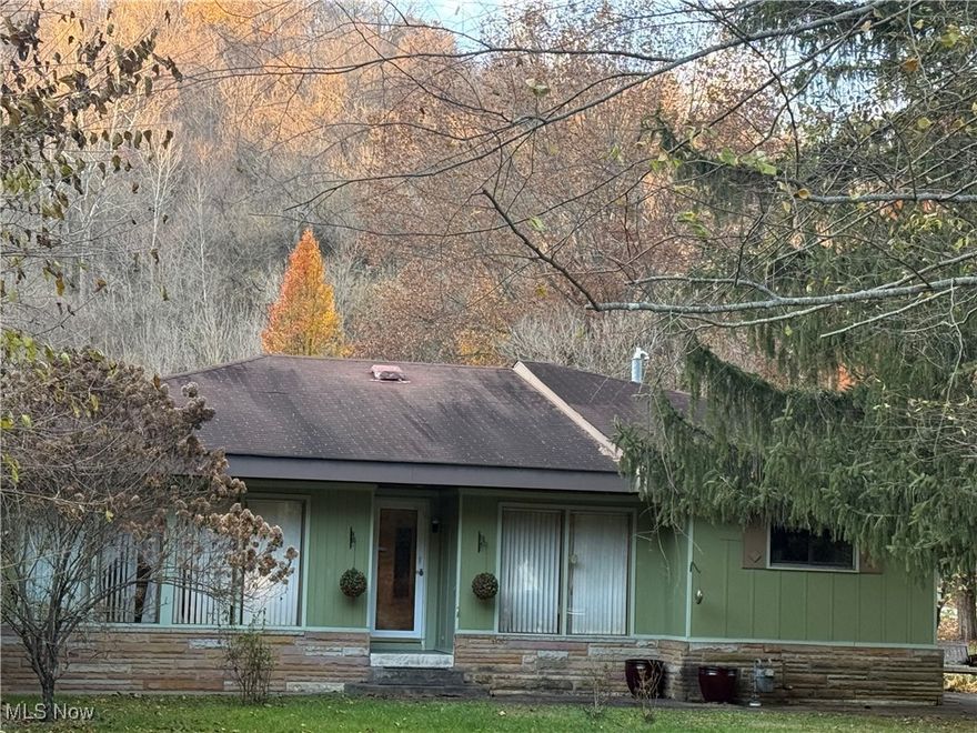 Discover the charm of this classic 2-bedroom, 1-bathroom ranch home nestled on a spacious 1.24 level acre lot in Bellaire. The large yard offers plenty of room for recreation, gardening, or expansion. The living room houses a cozy gas log fireplace, perfect for those Ohio winter nights. The huge laundry room with loads of cabinet space, makes doing chores easy and convenient. Oversized 2 car detached garage gives you plenty of room for a handyman's workshop with additional lean-to area on the side of the garage. The covered patio provides an outdoor entertaining space for gatherings with friends and family. Built in 1962, this well-maintained 1,400 sq ft residence offers a perfect blend of privacy and convenience. Located close to Bellaire Elementary School and just 10-15 from St. Clairsville.