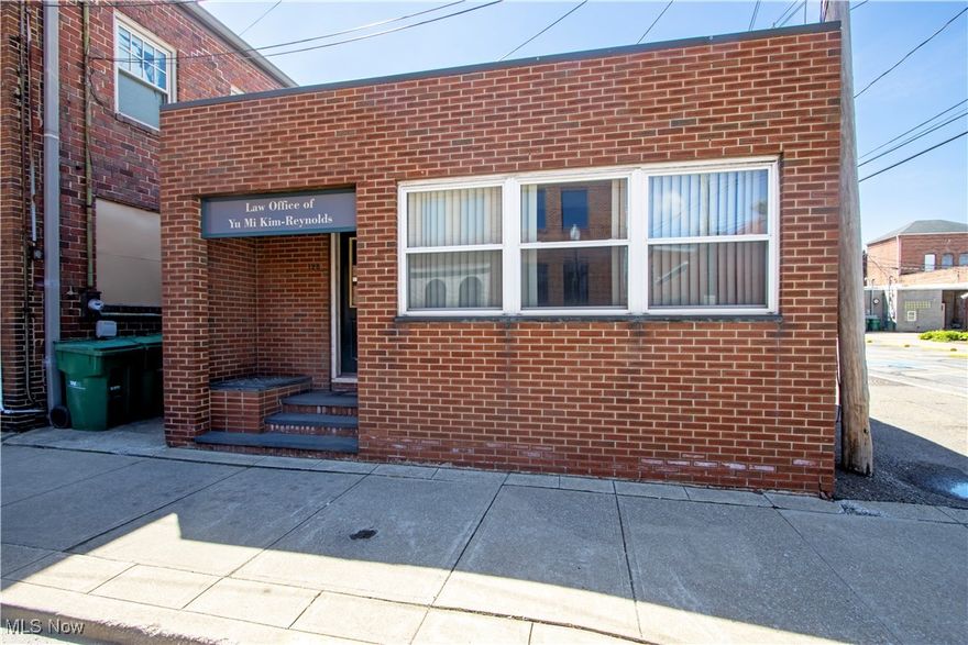 Prime Downtown Orrville Office Opportunity!  Welcome to 128 W Water Street, a versatile commercial property located in the heart of Orrville’s vibrant downtown. This office space offers excellent visibility and accessibility, making it ideal for a variety of professional uses. The building features multiple private offices, a welcoming reception area, and flexible open workspace. High ceilings and ample natural light enhance the overall work environment.  Situated just steps from local shops, restaurants, and public parking, this location provides convenience for clients and staff alike. Whether you're looking to expand your current business or invest in a solid commercial asset, this property offers exceptional potential in a desirable, walkable district.  Don’t miss your chance to own a piece of Orrville’s thriving downtown. Schedule your private showing today!