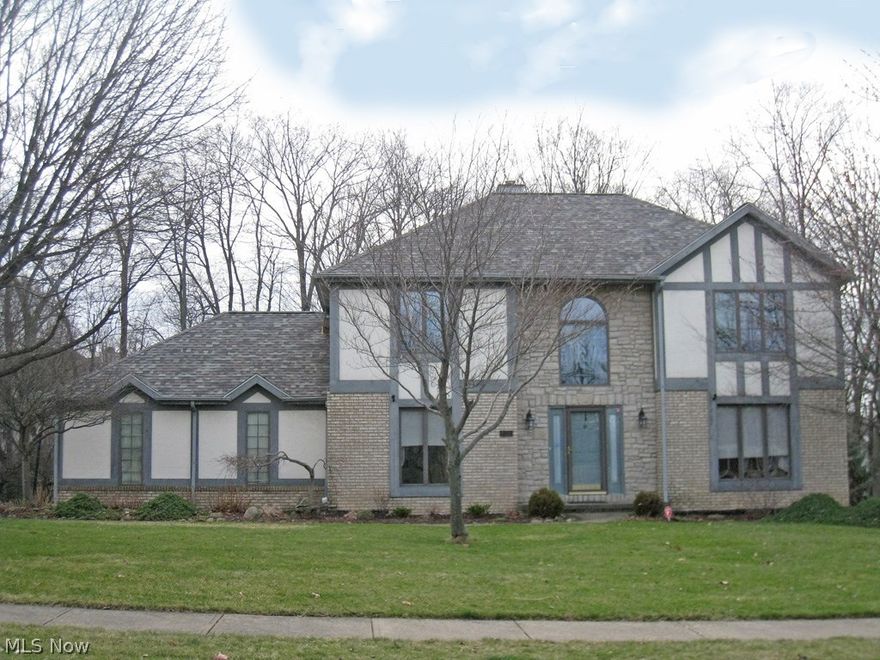 Lovely 4 bedroom, 2.1 bath tudor style home situated on a park-like 
setting in Southampton Estates! Featuring a 2-story foyer with ceramic flooring, formal living & dining rooms, and a family room with a gas fireplace. The spacious kitchen is open to the family room and offers a bayed dinette area, a center island, all appliances, and has panoramic views. The upstairs includes a master bedroom with a vaulted ceiling, a glamour bath with a jetted tub, a separate shower, and a walk-in closet. Three additional bedrooms and a main bath finish the 2nd floor. Completing this offering is a full, walk-out basement, a 2 1/2 car side garage, a newly installed roof in 2013, and a tiered deck overlooking the private & wooded yard. Located near the newly built YMCA &Library, and the award winning North Royalton schools!