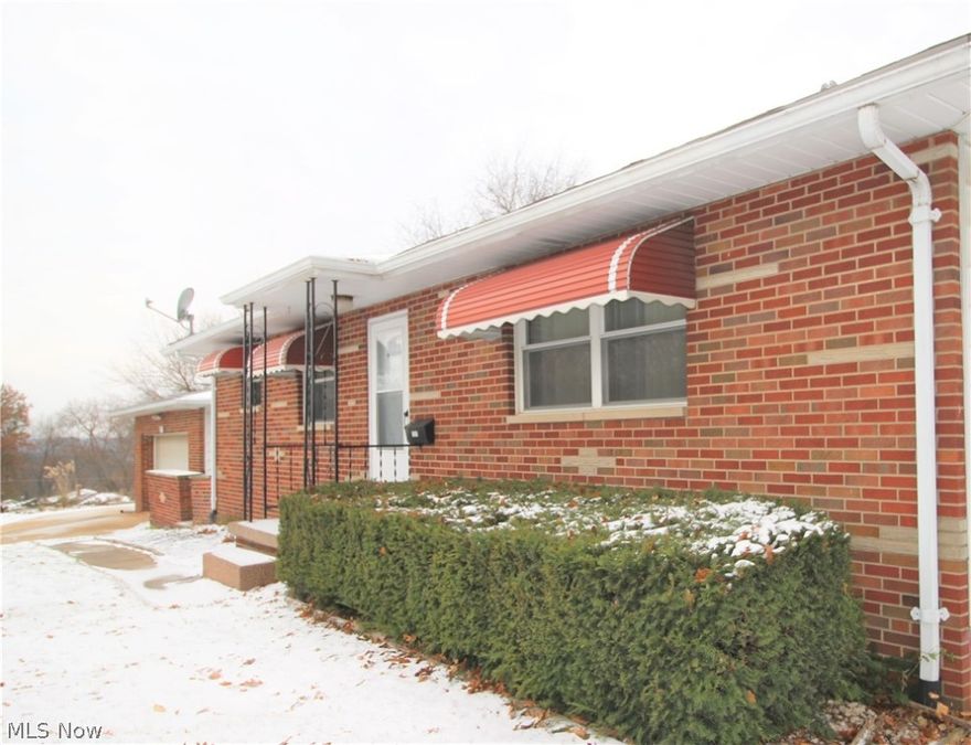 Brick ranch with full basement in Ellet!  This solid ranch offers 3 bedrooms and two full baths.  Open living area with eat in kitchen.  Large basement adds additional square footage with second full bath.  Two car garage with extra parking pad.  Nice patio area perfect for grilling.  Newer AC and Furnace.  Well maintained home.