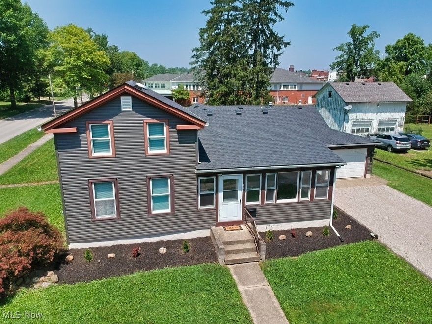 Welcome to this charming four-bedroom Colonial ideally situated in the heart of Downtown Wellington. Step inside through the enclosed front porch, perfect for year-round relaxation. The main level features a spacious primary bedroom, a second bedroom, a full bath, and convenient first-floor laundry. Upstairs, you’ll find two additional bedrooms along with ample storage space. The home also includes an attached two-car garage for added convenience. Recent UPDATES:  Professionally painted first floor interior (2025), New LVT Flooring throughout first floor (2025), New Carpeting (2025), Two Brand New Window Unit Air Conditioner (2025), New Ceiling Fans (2025), New Vanity (2025), includes a New Roof, Vinyl Siding, Boiler, and Hot water tank (All 2023), offering peace of mind for years to come. ) Don’t miss this opportunity to make this well-maintained home your own—schedule your private showing today! Extra lot .09 acres included in sale. That is zoned commercial, but used just as part of backyard.