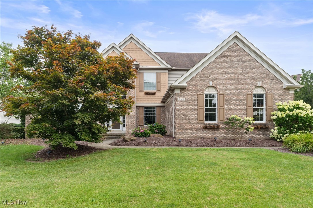 Tucked away in a desirable neighborhood, this beautifully updated colonial offers over 3,500 sq. ft. of luxurious living space, designed to impress at every turn. From the moment you step through the grand, vaulted two-story foyer, you’ll be welcomed by a sense of elegance and comfort. Just off the entry, a sun-kissed sitting room offers the perfect spot to unwind, while the expansive living room showcases dramatic ceilings, a gorgeous fireplace with custom surround, rich hardwood floors, and oversized windows that flood the space with natural light. The adjacent dining area continues the sophisticated ambiance, highlighted by modern lighting and sliding glass doors that open to the private patio. The chef-inspired kitchen is equally impressive—featuring stainless steel appliances, a central island, extensive wood cabinetry, tile flooring, a charming fireplace, and updated fixtures that blend style with everyday function. An additional bonus room on the main level offers flexible living options—ideal as a fitness studio or play area. A stylish half bath and a dedicated laundry room add everyday convenience. The first-floor primary suite is a serene sanctuary, offering both space and privacy, and featuring a spa-inspired en-suite bathroom with double vanities, a soaking tub, and a glass-door shower. Upstairs, you’ll find three spacious bedrooms, each with generous closets, and a beautifully appointed full bath with updated finishes. The finished lower level elevates the home’s entertainment value, boasting a recreation/media room, a custom bar, and a wine cellar—ideal for gatherings. Step outside to your own private escape. The backyard is beautifully landscaped and features a massive patio, a luxurious hot tub, and plenty of space to host guests or simply relax under the stars.
This exceptional home is the perfect blend of comfort, function, and upscale design—all set in a sought-after Twinsburg location close to parks, top-rated schools, shopping, and dining.