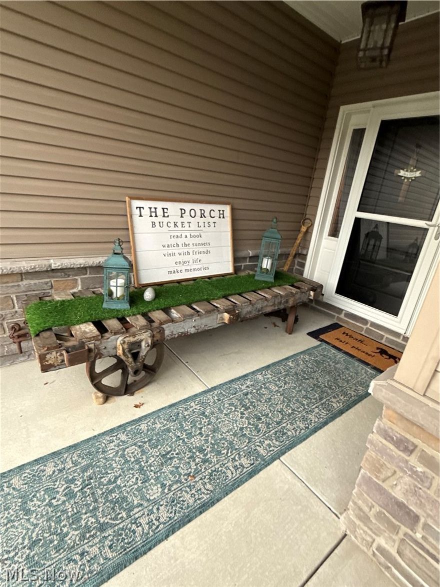 One Story living at its finest, this three bedroom home has two full baths. Home was built on an exterior upgraded wooded lot and offers plenty of privacy while sitting on the concrete rear patio. The covered front porch opens to a foyer and open floor plan great room. Gas fireplace and wall of windows for plenty of natural lighting. Kitchen, dining and laundry room has plenty of cabinetry, kitchen offers a breakfast bar. A two car attached garage with opener and hot/cold water. The owners suite offers vaulted ceilings and has a private bath with walk in closet. The association offers community pond, covered pavilion and playground and walk a short distance from the front door you can walk to Towpath Trail entrance.  Upgrades: carpet with exceptional padding, blinds 2014, new storm door, privacy fence 2016, doubled patio 2017, backsplash kitchen and master bath tub, kitchen faucet, closet organizer in 2nd bedroom, and landscaping 2018. Walk, bike, hike on the Towpath Trail, fish or relax at the community pond, picnic under covered pavilion, swing the afternoon away on the playground (adults and children alike). Affordable monthly fee also covers lawn and snow removal. Seller to find home of choice.