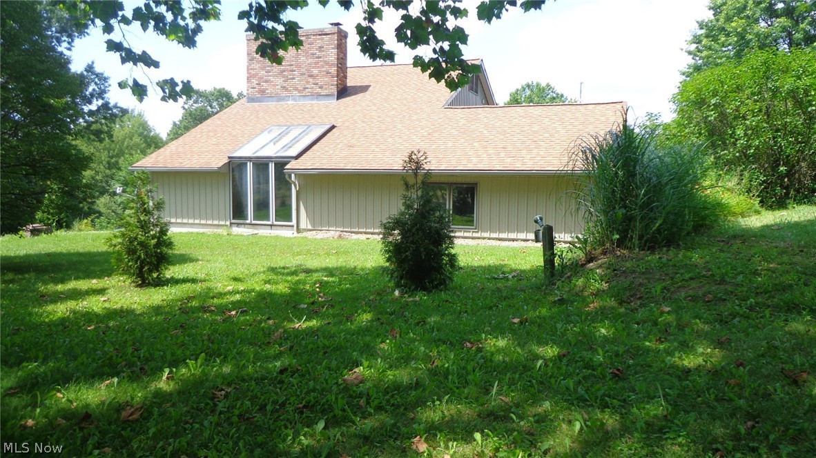 If you’ve been looking for a unique property with a multitude of upgrades and value, then look no further than this contemporary estate with over 2.67 acres of landscaped and wooded features. The house was built according to masonry standards by a family that belonged to the Free Masons which can be displayed by it’s 15 x 20ft tall hand laid brick fireplace. The exterior has a stone retaining wall with advanced drainage system and built in lighting to greet you at the entrance. Newer vertical steel siding is guaranteed for a lifetime as well. The massive 40x40 exterior outbuilding adjacent to the house with cement floor is heated and wired for any kind of a workshop including a business, RV Parking, work shop, car collecting and beyond. If the outside isn’t enough to keep you busy then the completely renovated interior will welcome you in with it’s new flooring, countertops, paint, bathrooms, carpet in basement and handmade woodwork. Tall ceilings and a lofted master suite with a full
